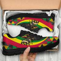 Men’s sneakers in box with Ethiopia Rasta lion print, black upper, white laces, white sole