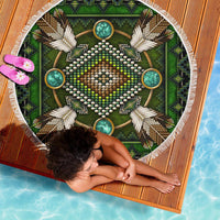 Green mandala beach blanket on deck, white fringe and turquoise circle bead details