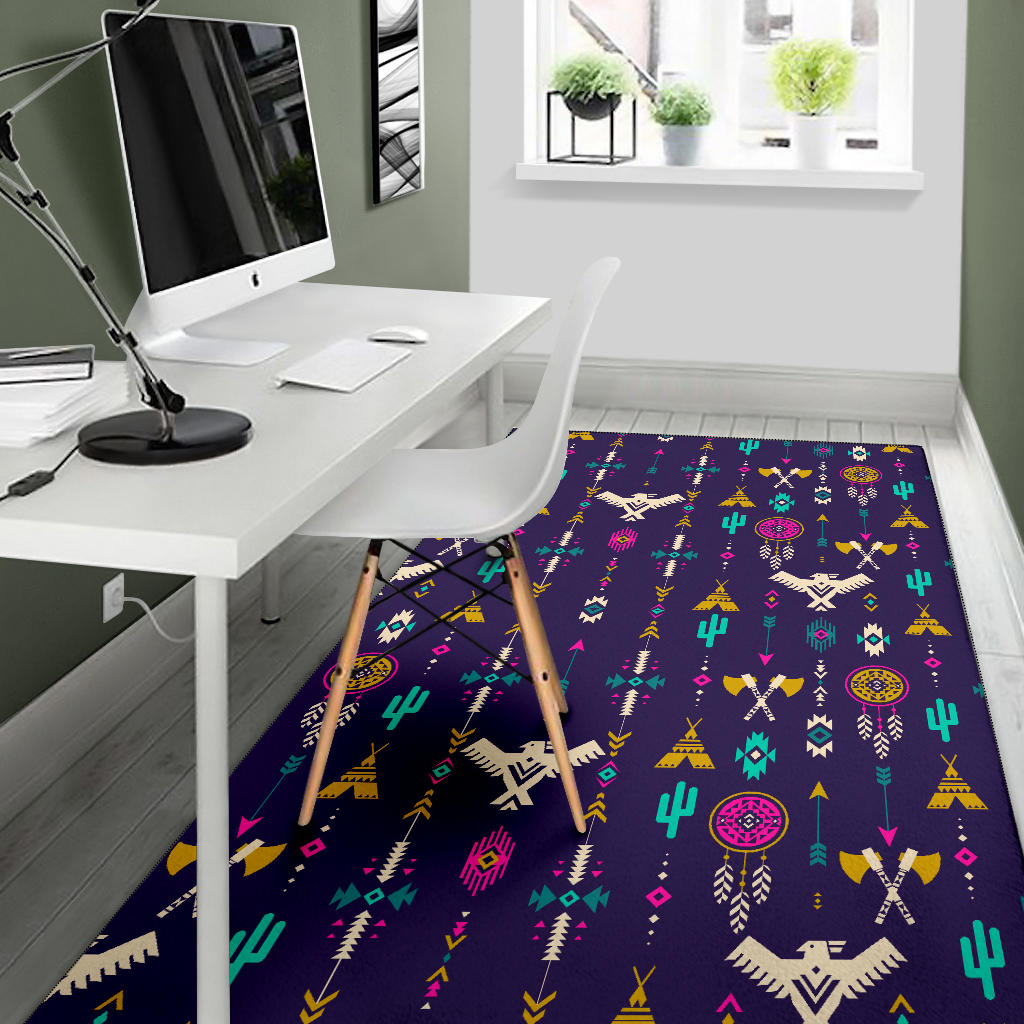 Thunderbird pattern area rug in dark blue with multicolor desert icons, office nook view