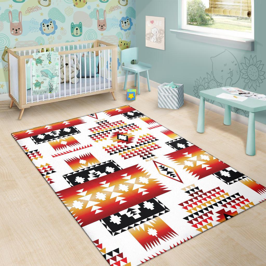 Native geometric area rug: white ground with red stripes, black motifs, yellow accents