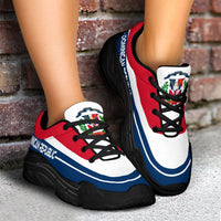 Pair of red chunky sneakers with white/blue stripe panels and thick black outsole