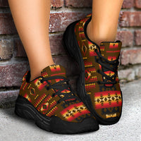 Chunky sneakers with black sole, Native tribal print and black laces on feet