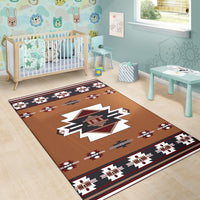 Native American area rug in brown with starburst center and repeating native-style motifs