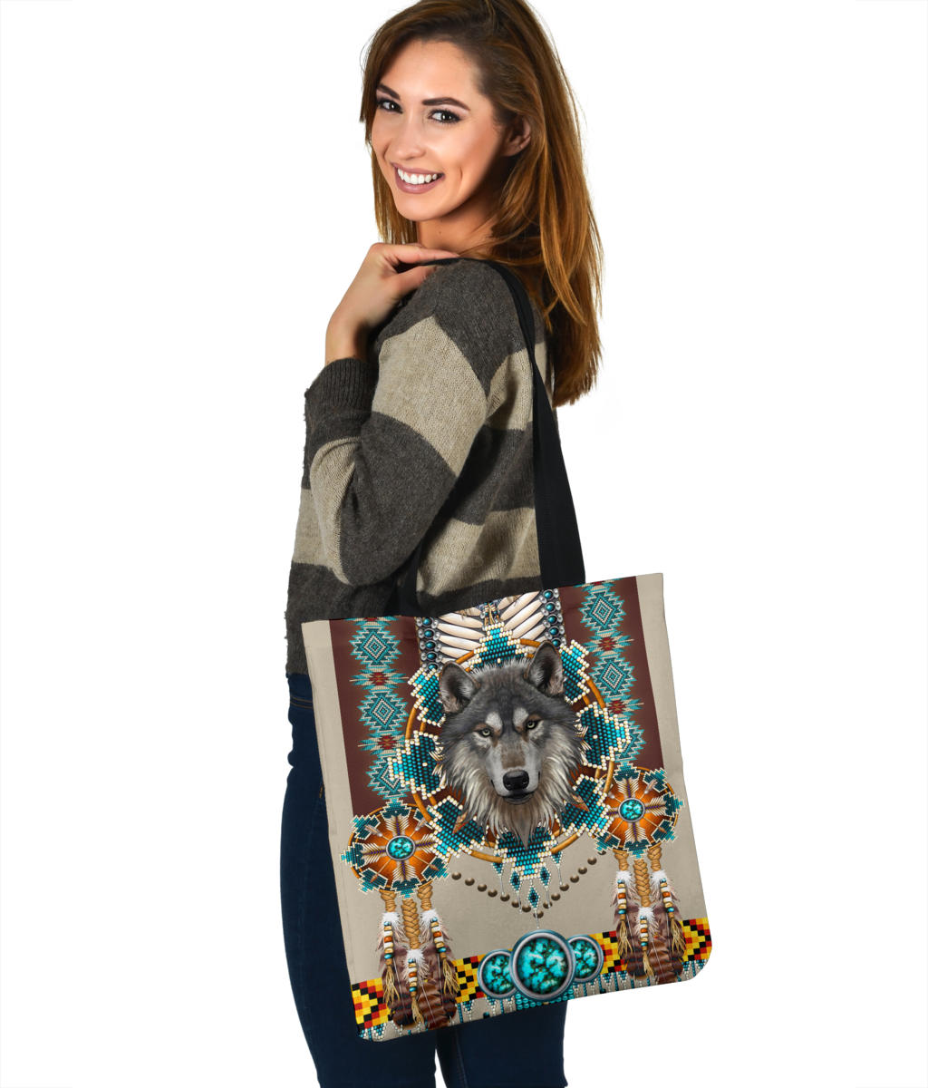Multicolor wolf mandala tote bag with turquoise oval buckle motif, angled front view