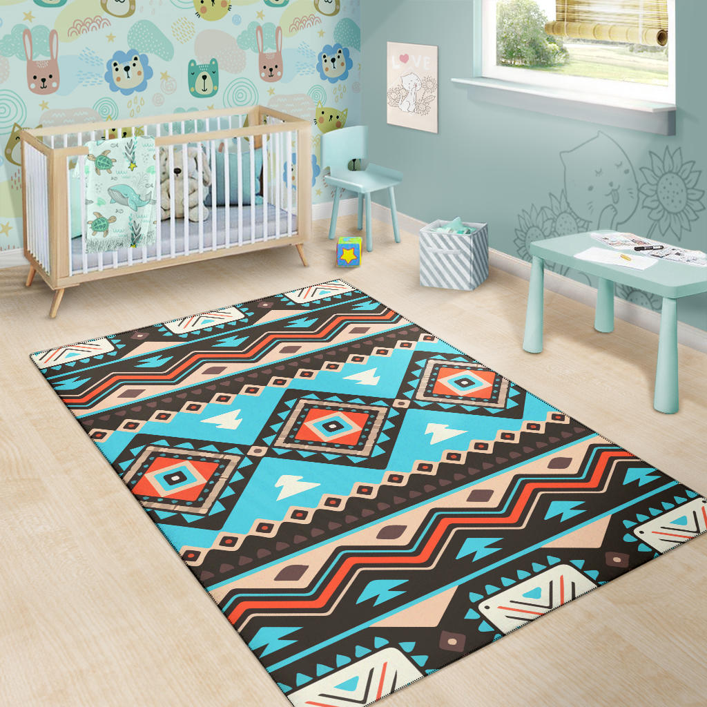 Children’s room tribal pattern area rug with teal, brown, and beige motif blocks