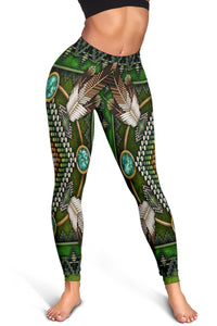 Green leggings waistband to ankle with turquoise ovals, feather motifs, and multicolor beadwork