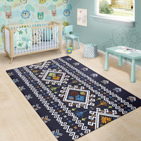 Navy patterned area rug with white repeating geometric shapes and colorful diamond blocks