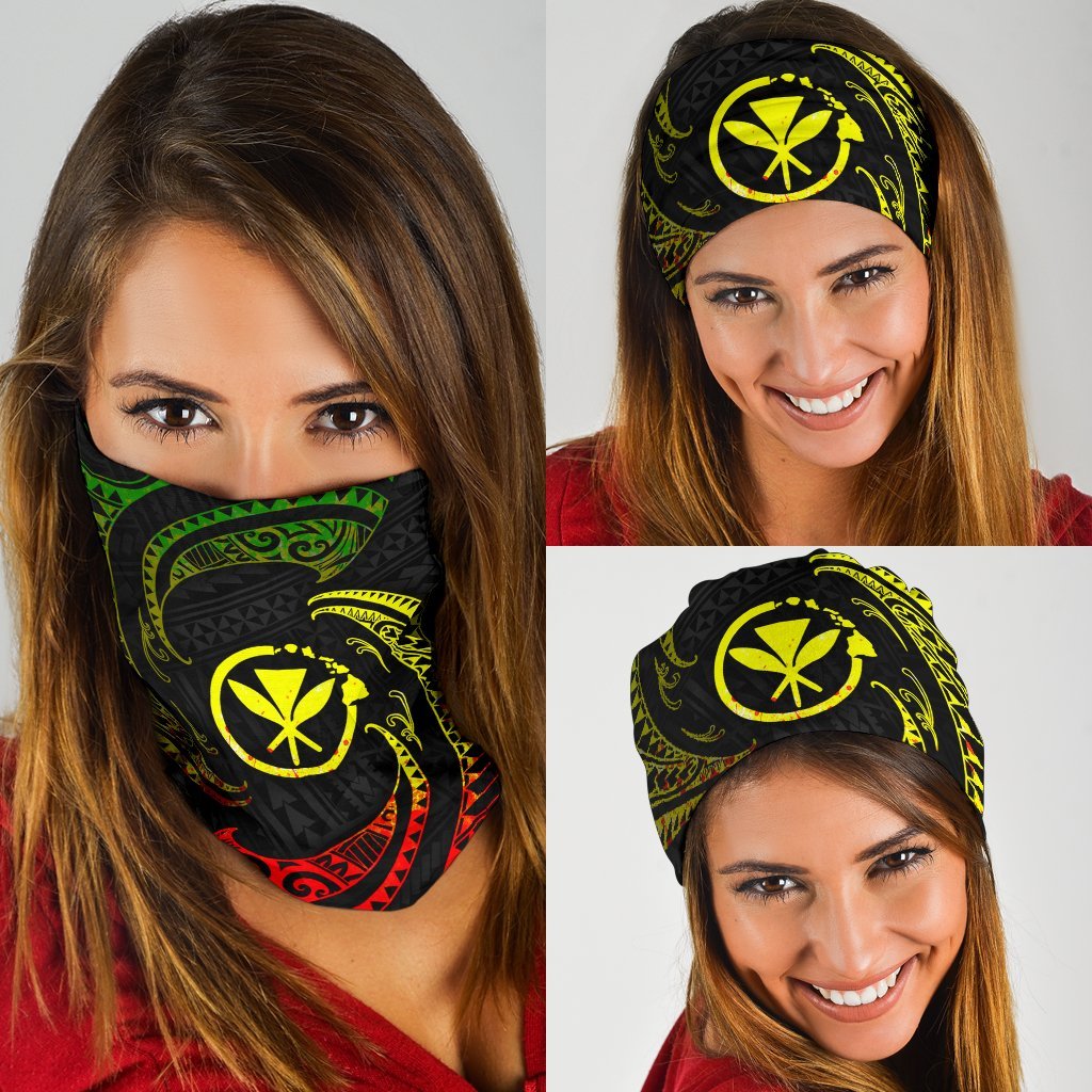 Black bandana with yellow tribal emblem and red-green swirls, worn by woman