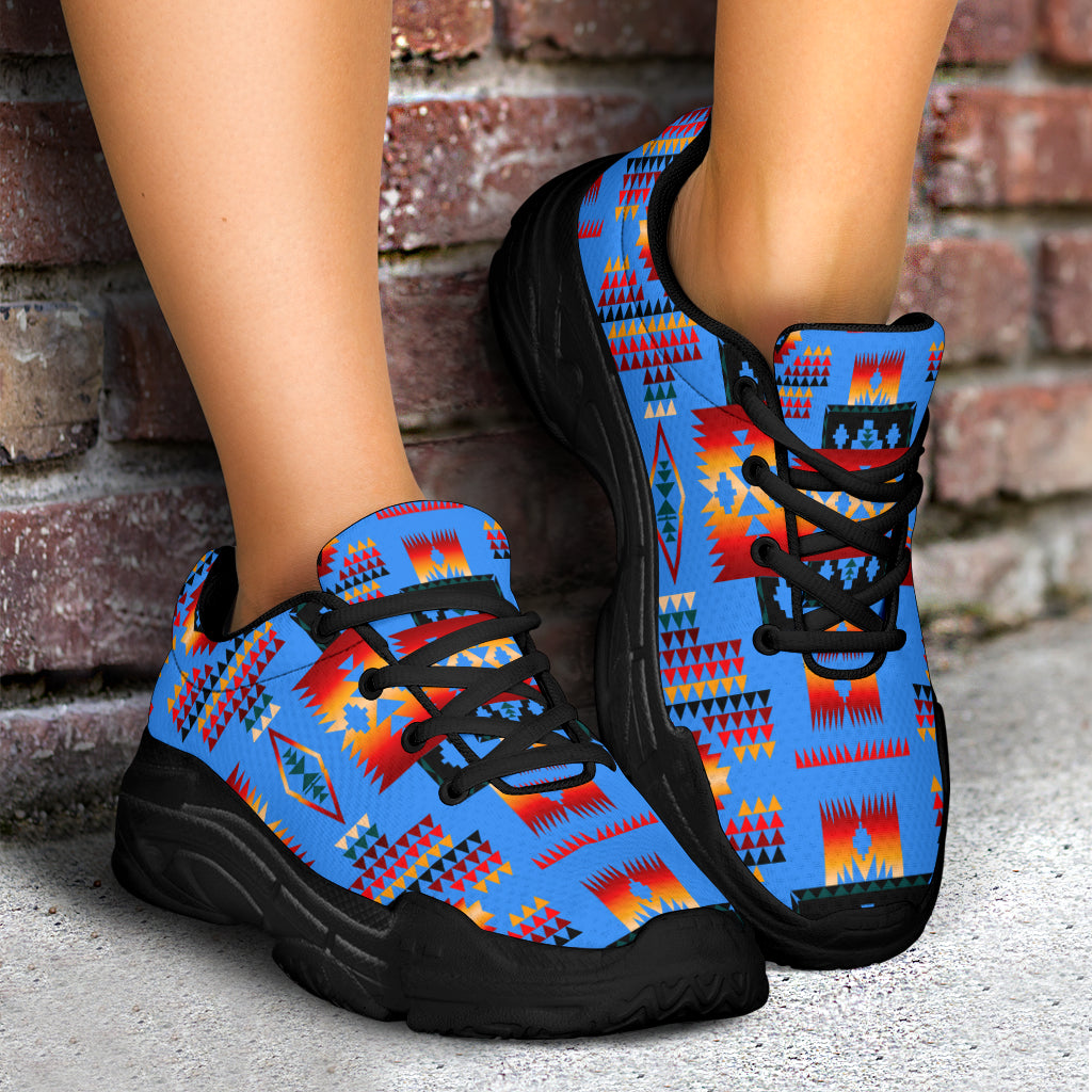 Chunky sneakers, blue tribal pattern uppers with black laces and black sole