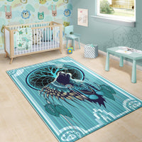 Teal and blue wolf chief area rug with dreamcatcher ring, feathers, and geometric stripes