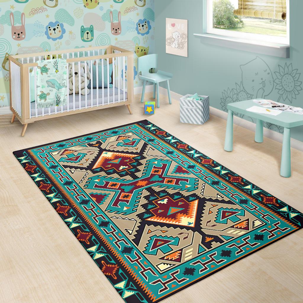 Geometric tribal area rug with teal, tan, and orange motifs in a bold border