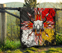 Front view quilt featuring bison skull, horn points, and multicolor radial arrow lines