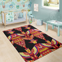 Black area rug with multicolor winged motifs and geometric bands