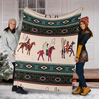 Chief horse blanket held indoors, teal and burgundy geometric bands with horse riders