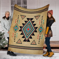 Southwest symbol blanket in tan with large diamond centerpiece and matching geometric corner triangles