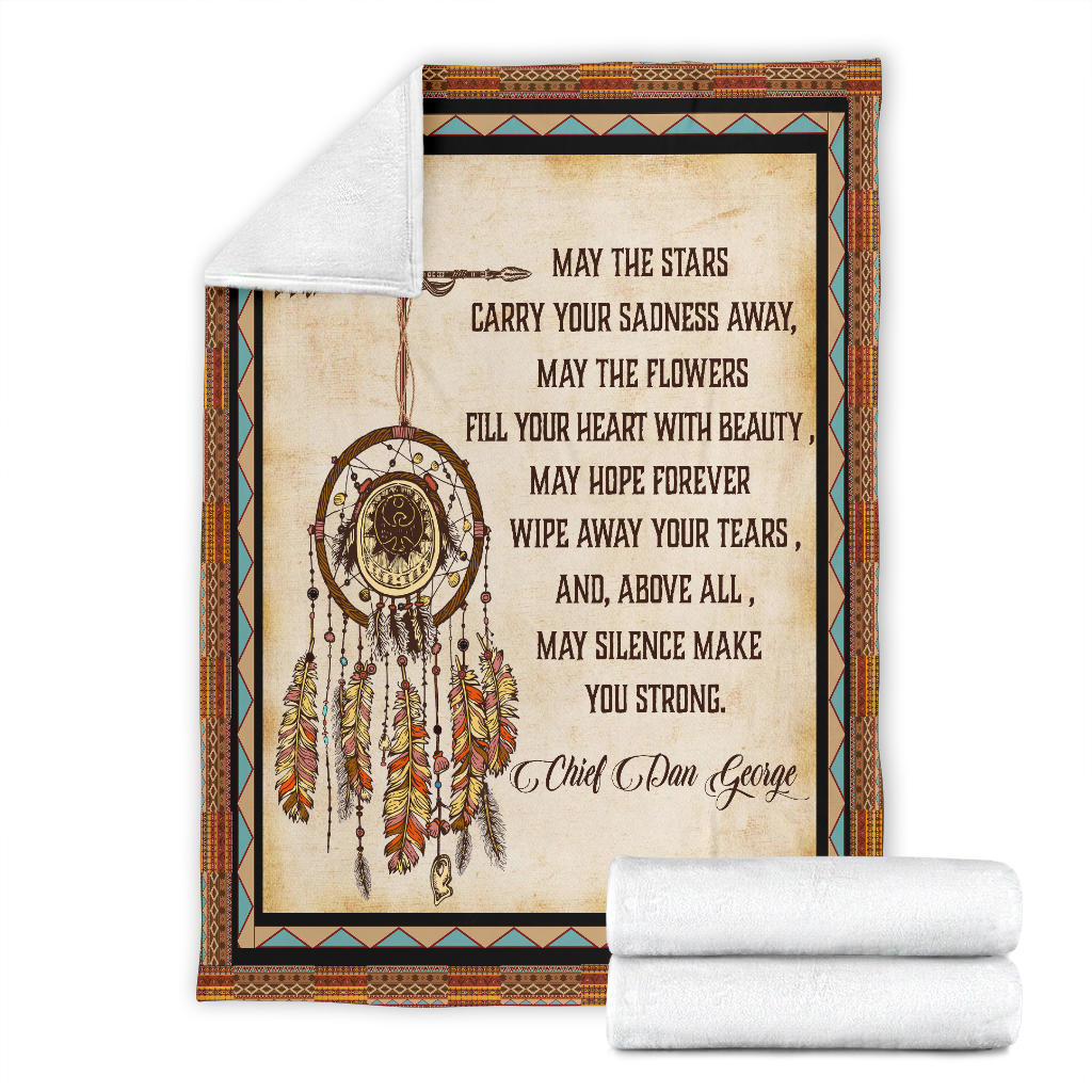 Cream Native-style blanket with dreamcatcher quote, plus folded white rolled throws