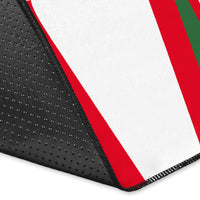 Black edge close-up with red-and-white stripes on the multicolor area rug