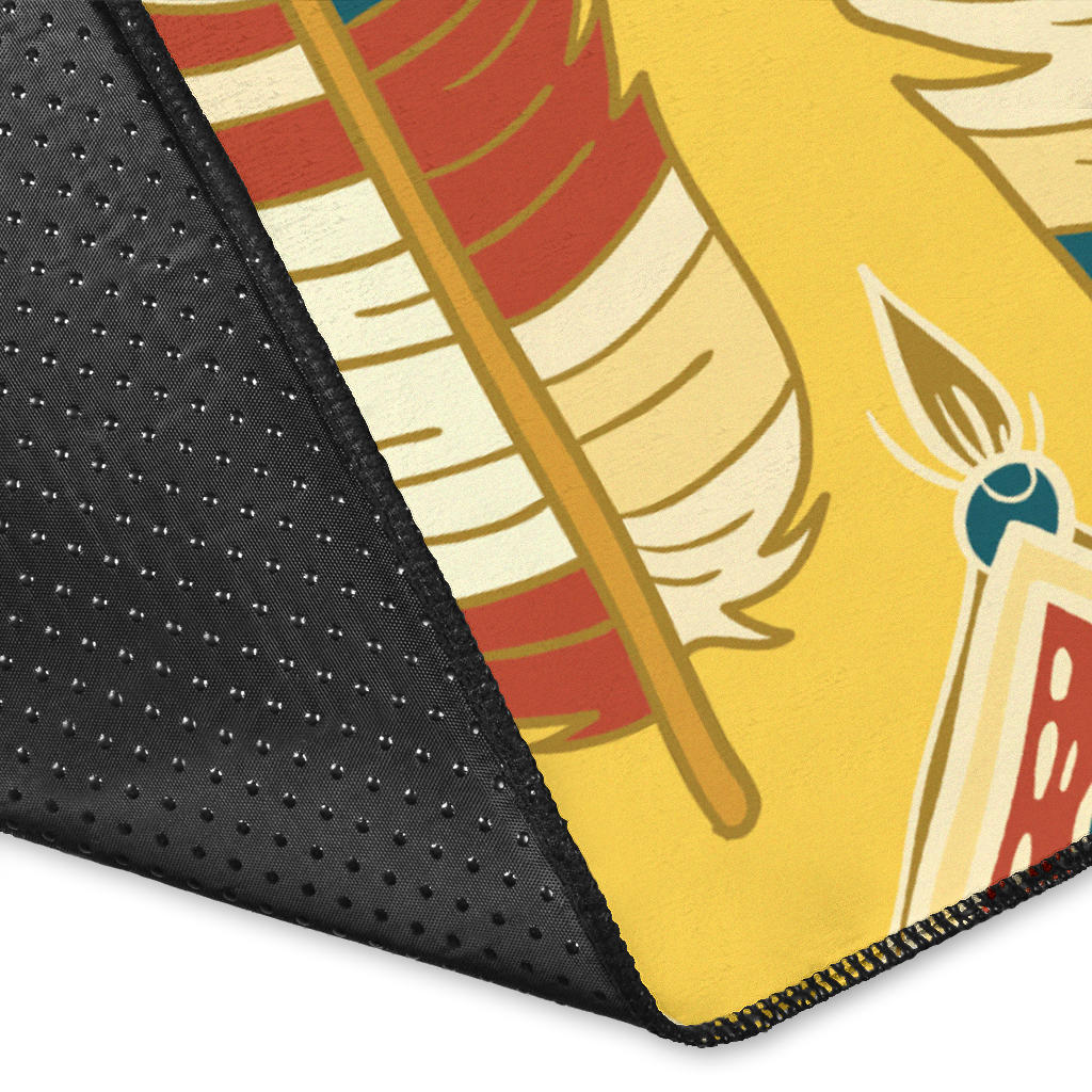 Close-up corner of yellow feather area rug with patterned edge and stitching