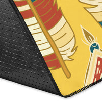 Close-up corner of yellow feather area rug with patterned edge and stitching