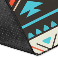 Close-up corner of tribal line pattern area rug with dark textured binding