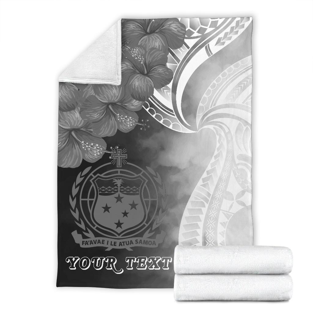 Folded premium blanket with black-and-white crest design and 'YOUR TEXT' lettering