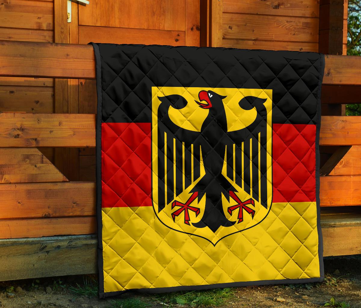 Germany flag quilt on porch with black quilted border and centered eagle crest