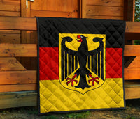 Germany flag quilt on porch with black quilted border and centered eagle crest