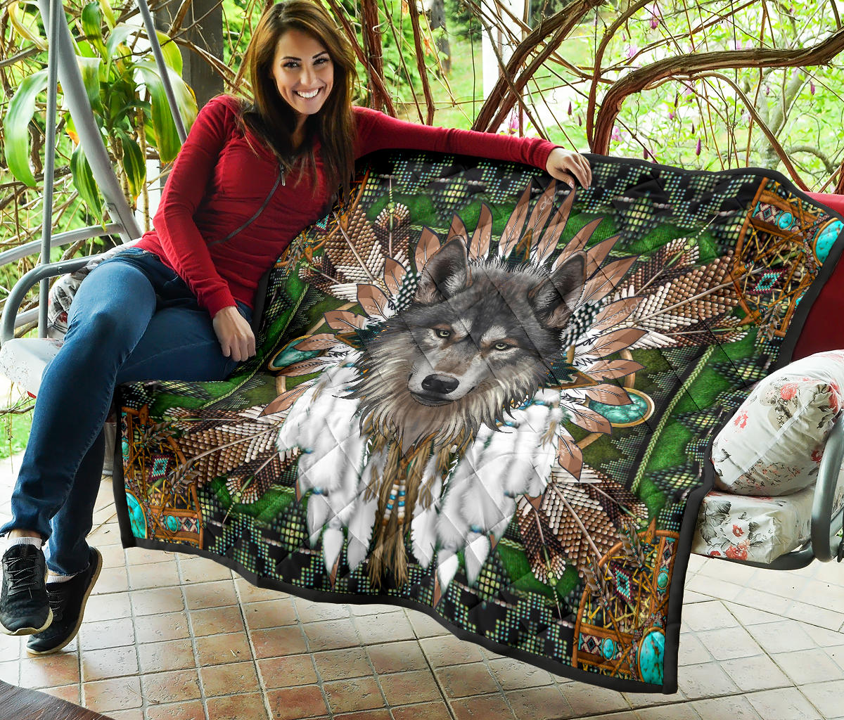 Wolf mandala quilt on patio, green multicolor tribal design with turquoise corner accents