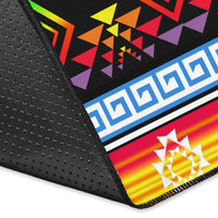 Corner close-up of black area rug edge with dotted texture and colorful trim