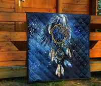 Navy quilted dreamcatcher blanket with blue rings, gold accents, starry speckle pattern
