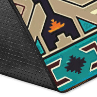 Rug corner close-up with black backing and geometric teal pattern border