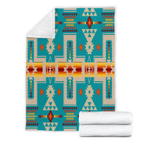 Turquoise multicolor tribal blanket, folded with light reverse and crisp patterned edges