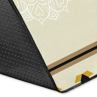 Chief and Warriors rug corner detail, black textured edge with stitched trim and yellow accents