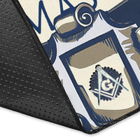 Close-up of blue rug corner with embroidered-like Freemasonry emblem and textured edge
