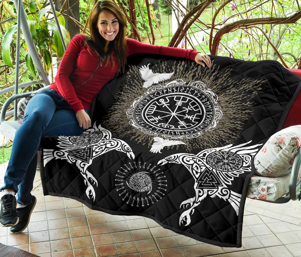 Black Viking quilt on patio bench showing round Vegvisir/Valknut emblem and wing motifs