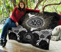 Black Viking quilt on patio bench showing round Vegvisir/Valknut emblem and wing motifs