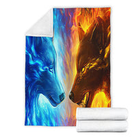 Ice Fire Wolf blanket with matching rolled white towels, blue-and-orange wolf print