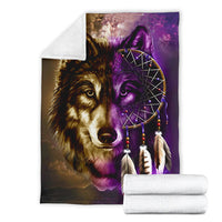 Wolf and purple dreamcatcher blanket shown with rolled white towels