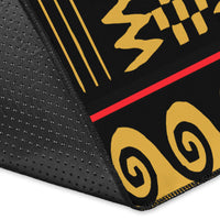 Close-up corner of black-and-yellow border with red-and-black rug edge stitching