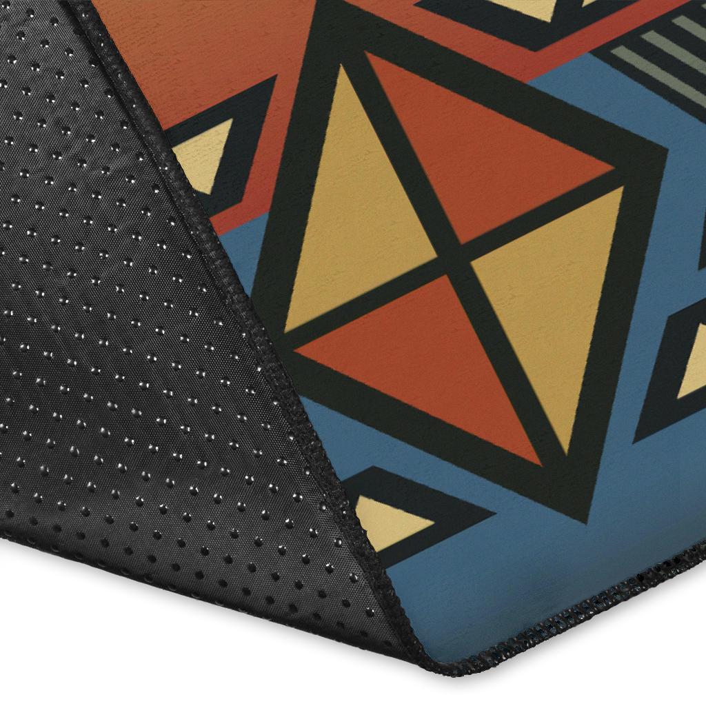 Close-up corner of Southwest rug showing geometric shapes and dotted texture on dark edge