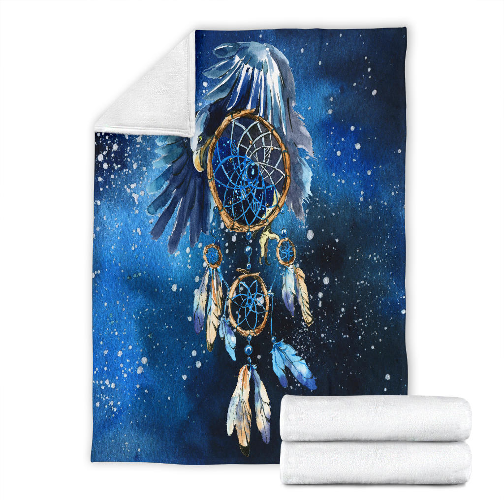 Folded blue galaxy dreamcatcher blanket with central ring web and feather graphic