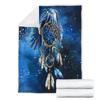 Folded blue galaxy dreamcatcher blanket with central ring web and feather graphic