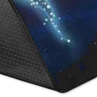 Corner close-up of galaxy wolf rug with dark backing, star pattern, and stitched edge