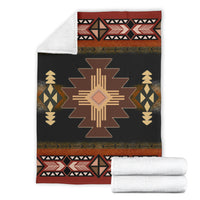Geometric blanket with folded white backing, black, brown, red star and stripes