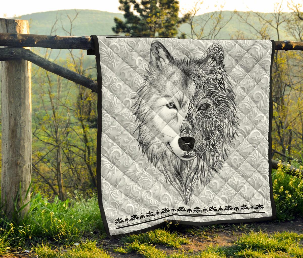White quilt with black-trim edge and detailed grayscale wolf head illustration