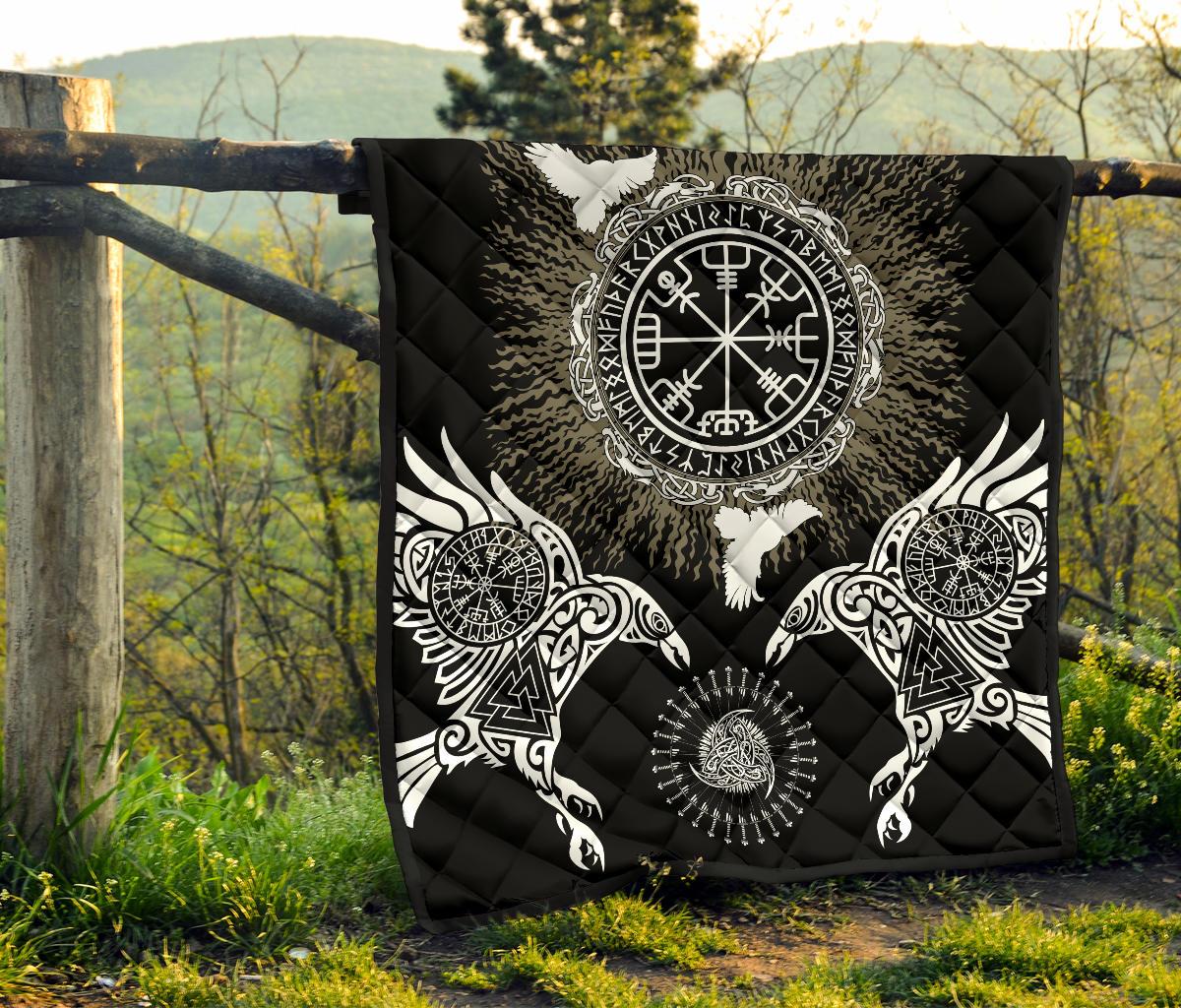 Black quilt hanging outdoors featuring central Valknut/Vegvisir emblem and large wing symbols