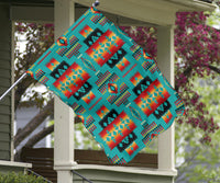 Multicolor geometric pattern flag, close-up view with teal orange red yellow shapes on fabric