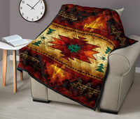 Quilt on beige armchair: red, gold, and green southwest-style star pattern with dark border