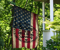 Patriotic house flag on porch post, star field and red/cream stripes with “You are… Strong”