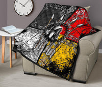Chief Arrow quilt on couch back, multicolor red black yellow white feather-arrow pattern